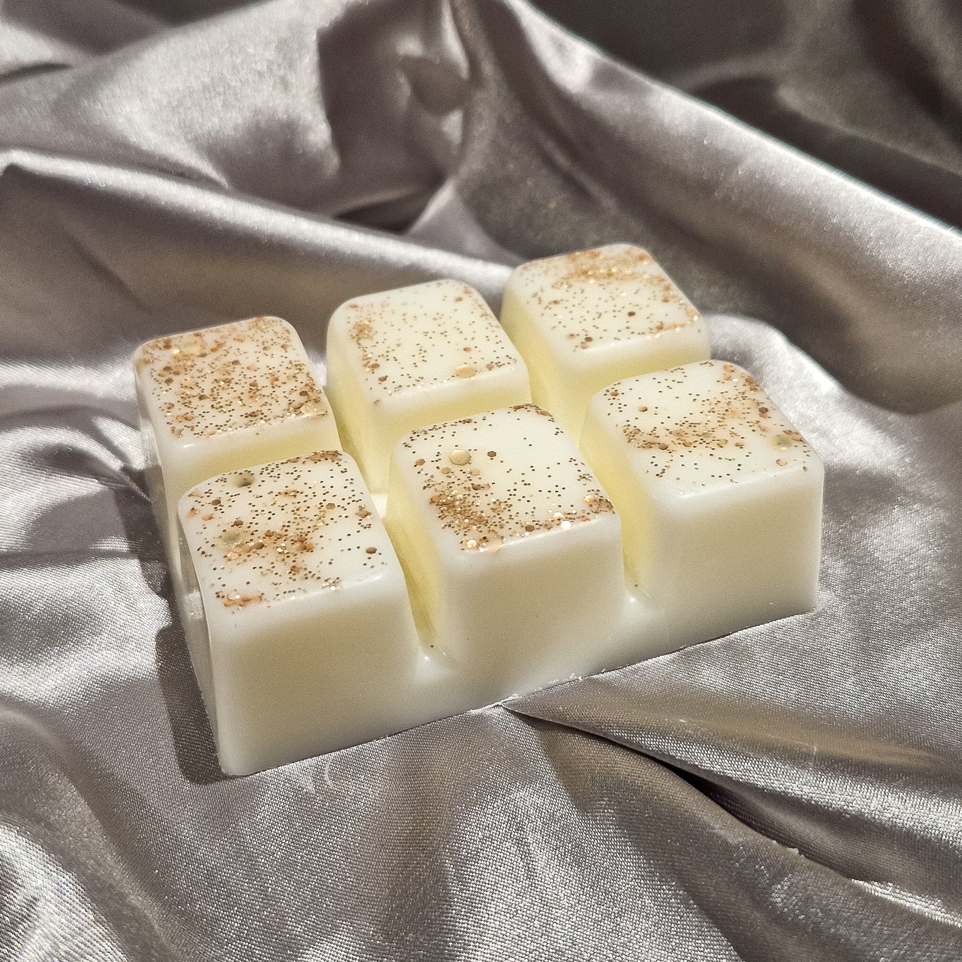 Blushing Orchid wax melt showing the glitter