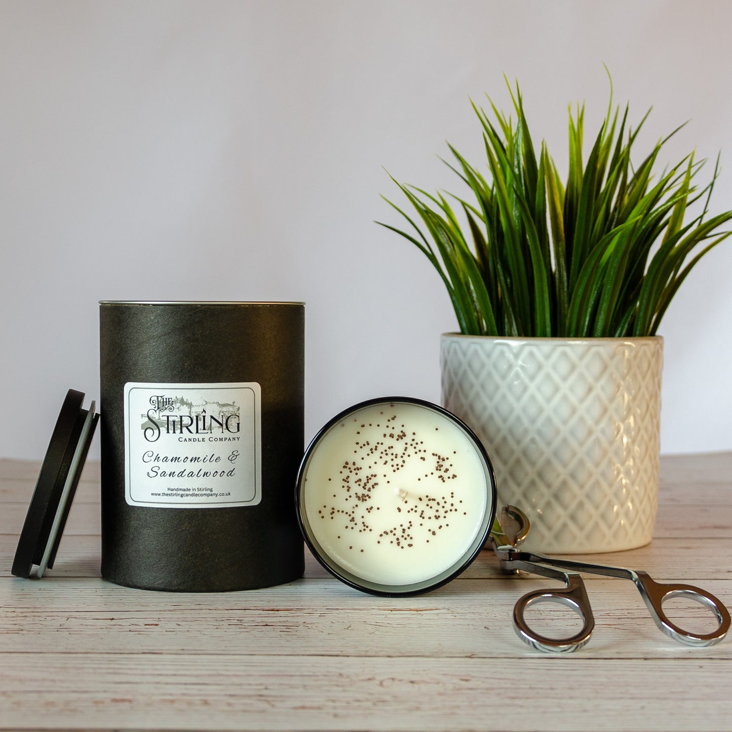 Side on view of Chamomile and Sandalwood large black candle