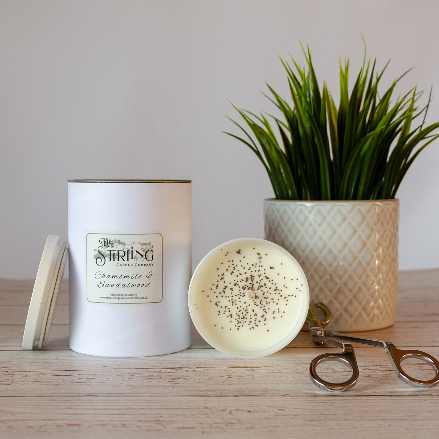 Side on view of Chamomile and Sandalwood large white candle
