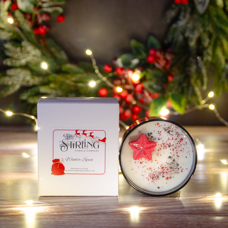 Black candle in the fragrance Winter Spice with matching box
