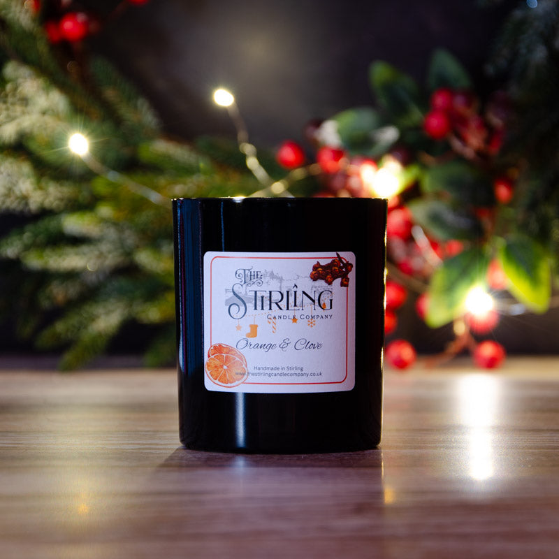 Black candle in the fragrance Orange and Clove