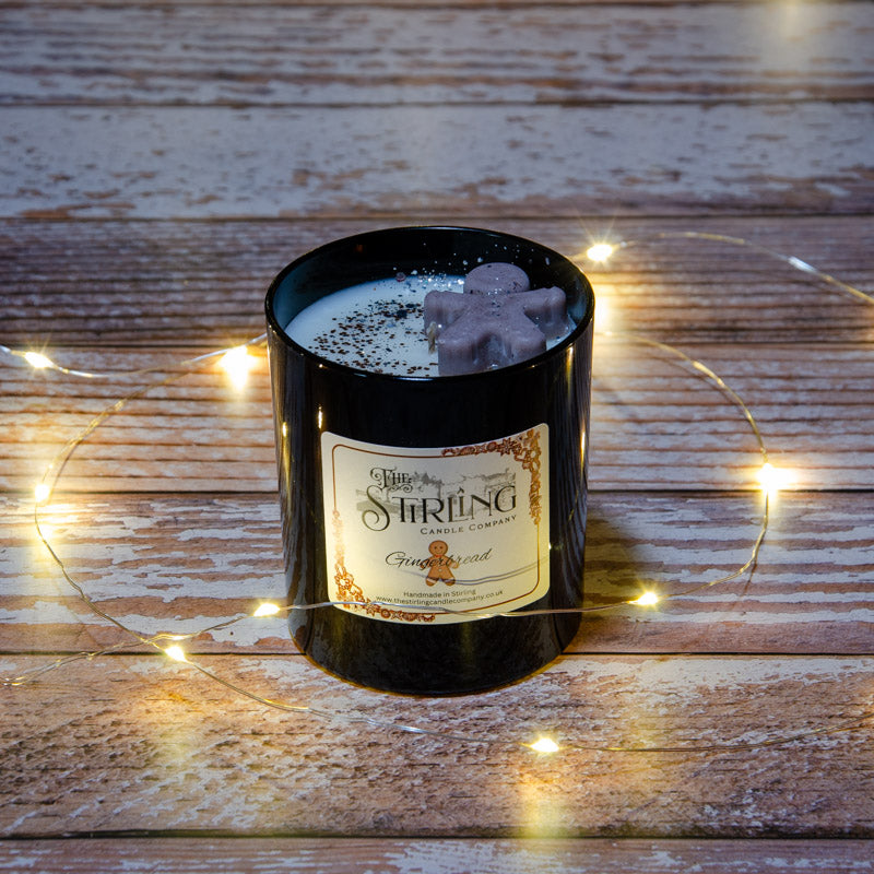 Black candle in the fragrance Gingerbread, top view