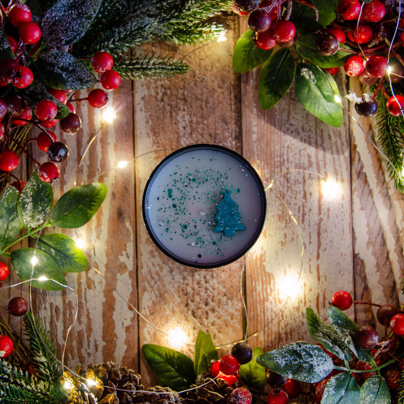 Black candle in the fragrance Christmas Tree, top down view