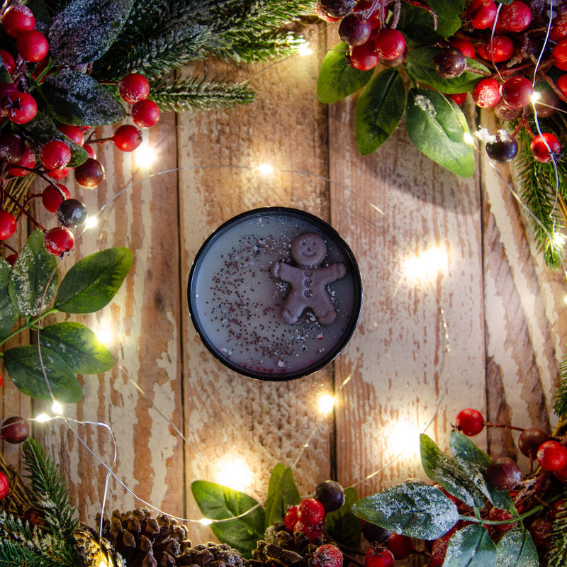 Black candle in the fragrance Gingerbread, top down view