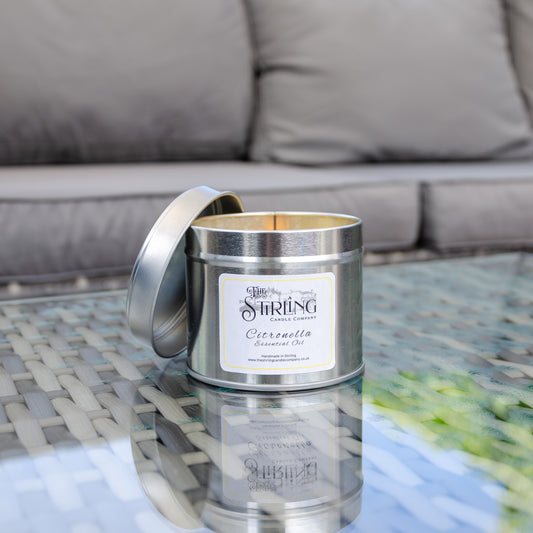 Citronella candle set on a glass table