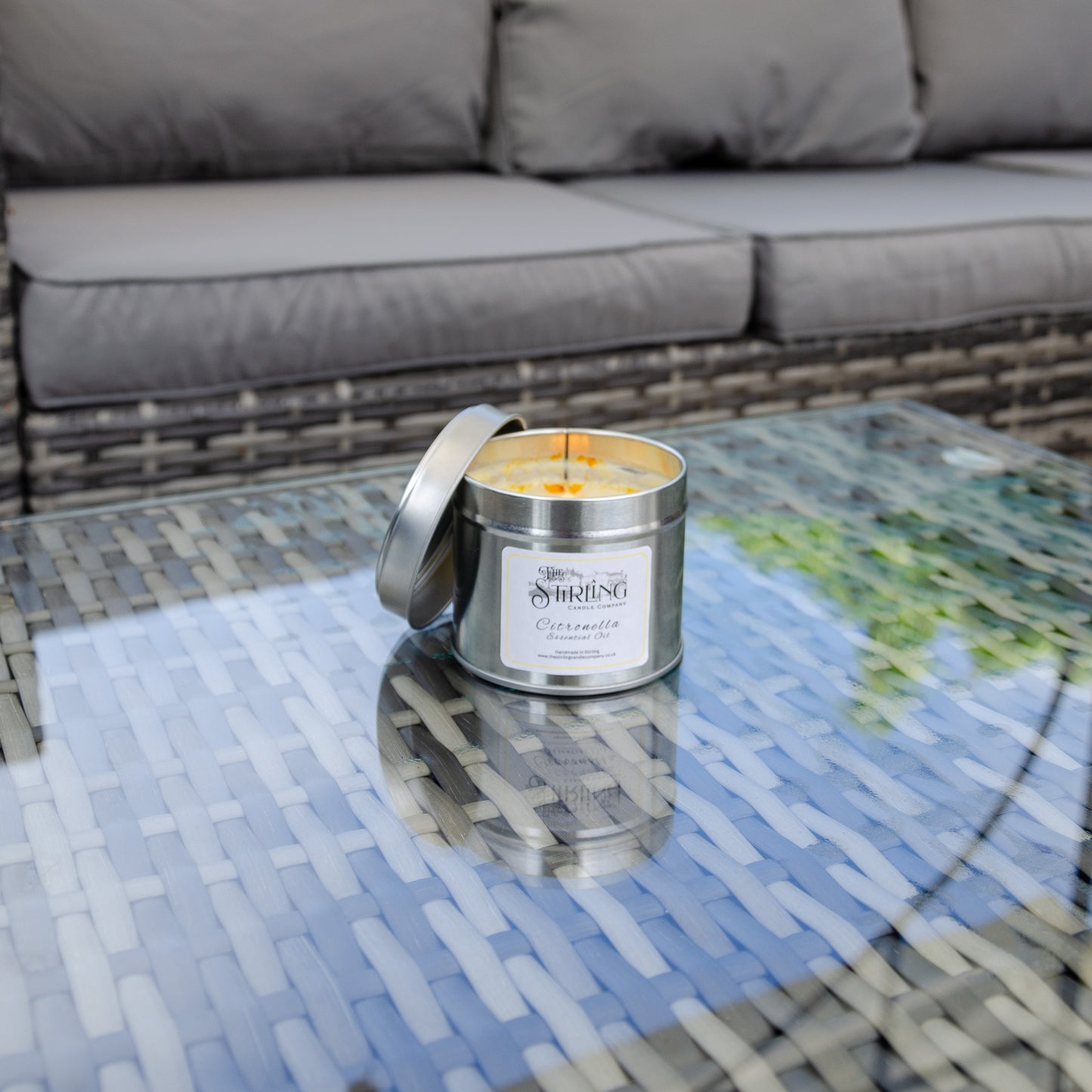 Citronella candle set on a glass table