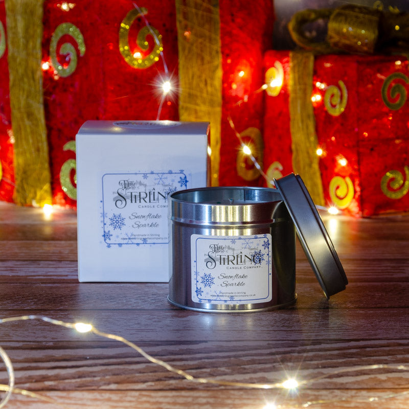 The Stirling Candle Company medium travel tin with box candle in the fragrance Snowflake Sparkle