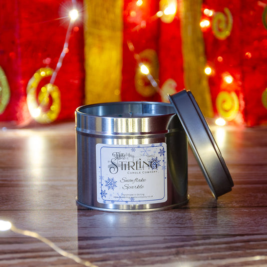 The Stirling Candle Company medium travel tin candle in the fragrance Snowflake Sparkle